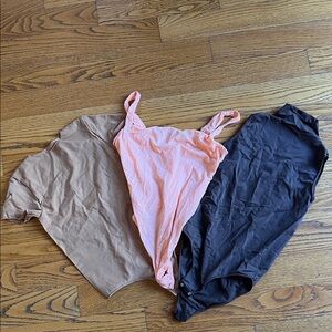 Set of Three Skims Bodysuits in Pink, Tan, and Black